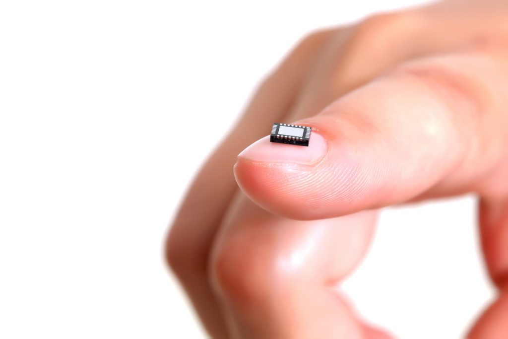 Computer Microchip on Girl's Fingernail